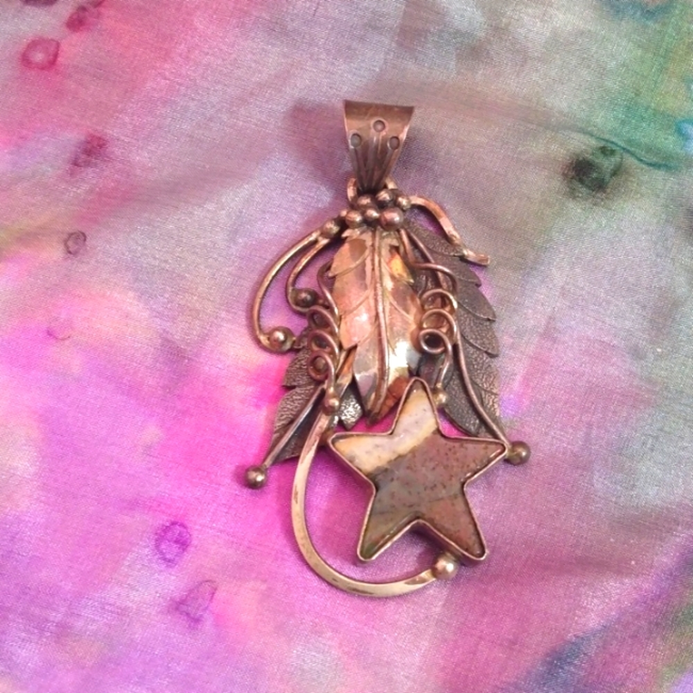 Sterling silver pendant with agate star